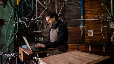 Small business owner working on laptop